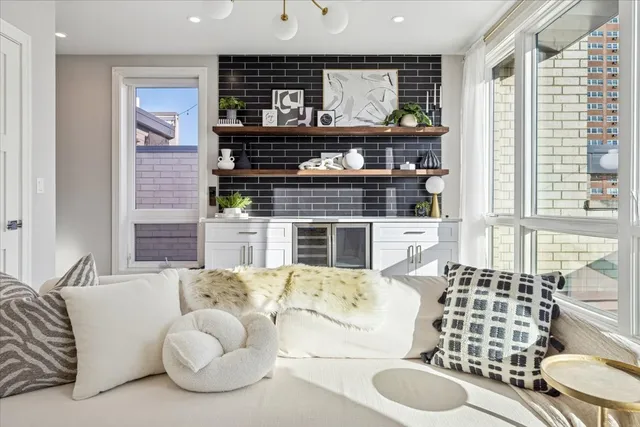 a kitchen with stainless steel appliances kitchen island granite countertop a stove and cabinets
