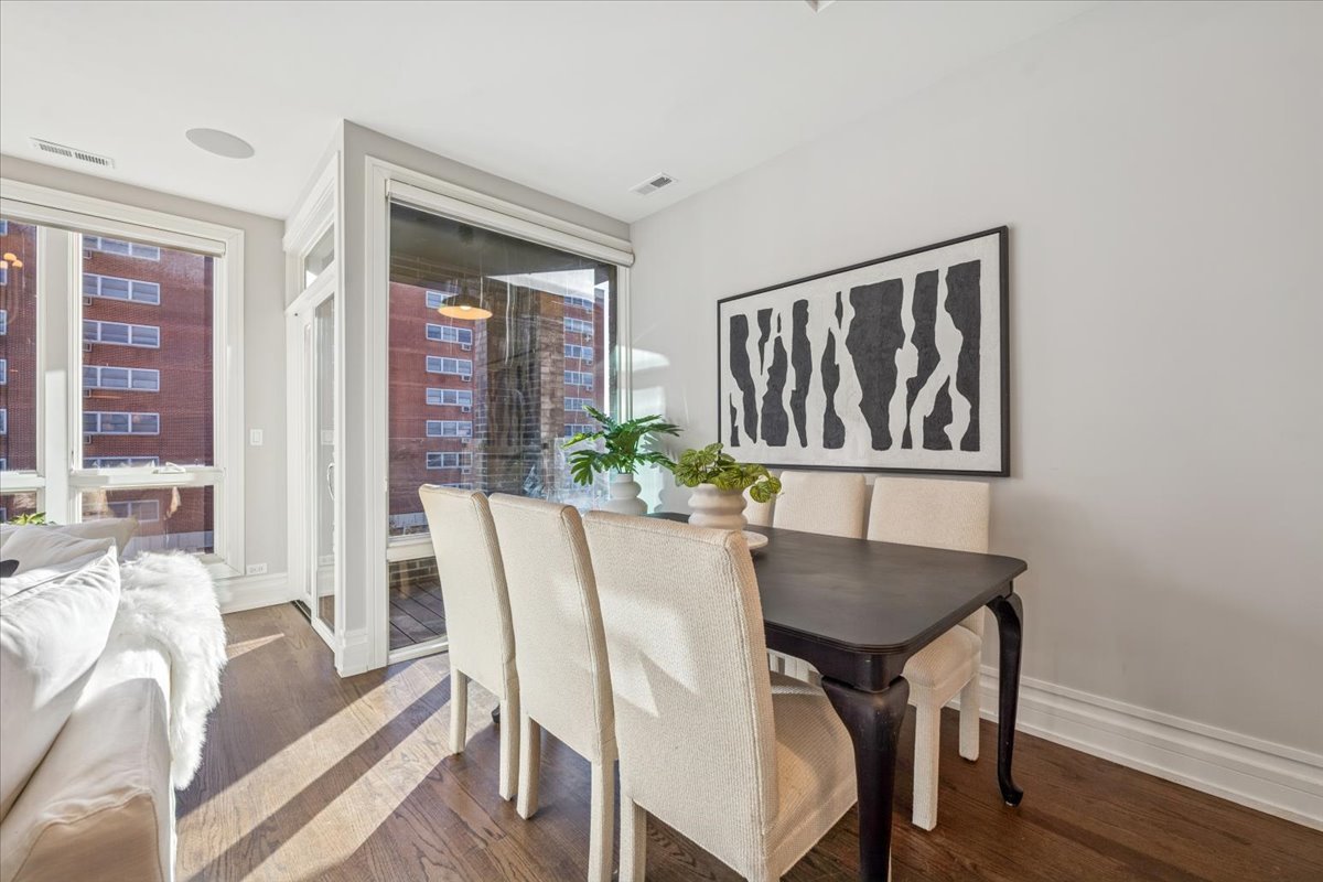 1448 West Chestnut Street, Unit 3 Chicago, IL 60642 - Photo 8 of 46 a view of a dining room with furniture window and wooden floor