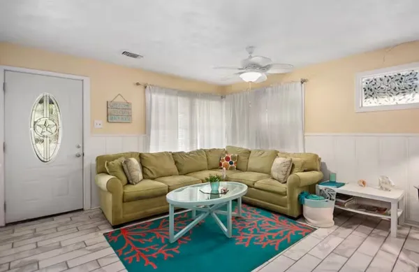 a living room with furniture and a rug