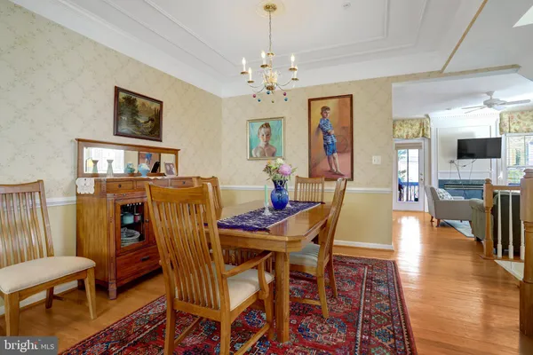 a living room with furniture and large windows