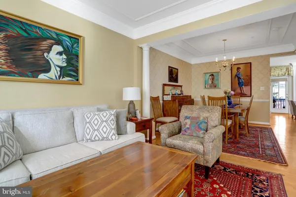 a living room filled with furniture and a floor to ceiling window