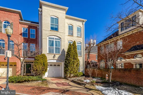 a view of a brick building next to a yard