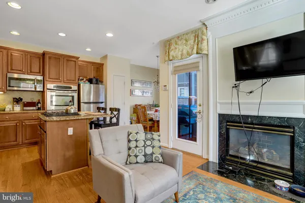 a kitchen with stainless steel appliances granite countertop a sink and cabinets
