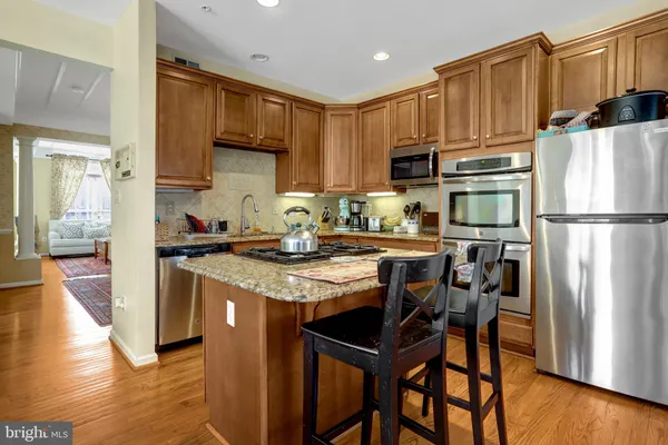 a view of balcony with two chairs and a window