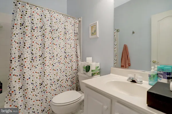 a bathroom with a sink double vanity and a mirror