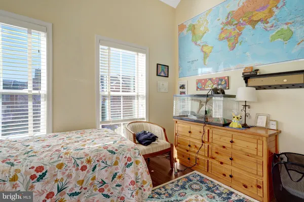 a bathroom with a toilet and a shower curtain