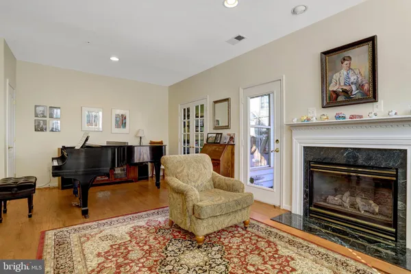 a view of a dining room with furniture and windows