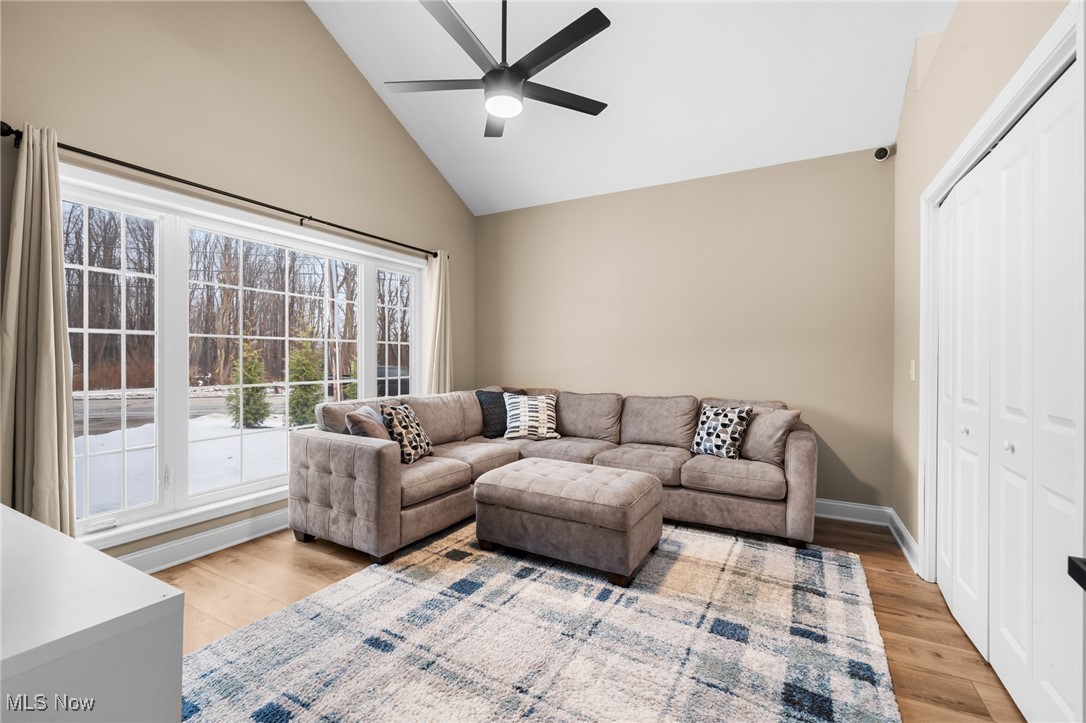 39600 Aurora Road Solon, OH 44139 - Photo 6 of 49 Living room featuring high vaulted ceiling and a ceiling fan this room can also be a 1st floor BR & has a large closet