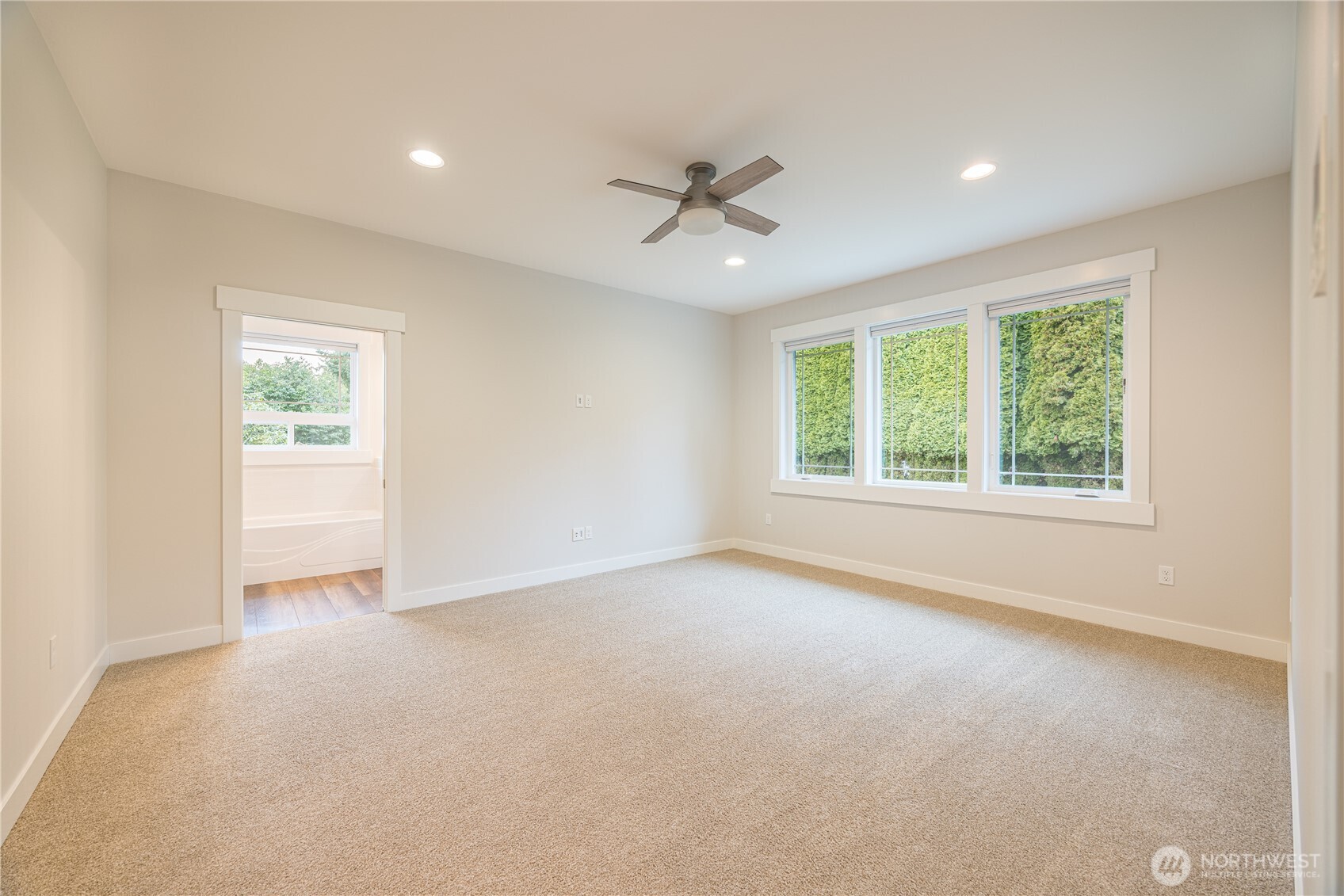 127 Sunrise View Avenue Sequim, WA 98382 - Photo 17 of 31 an empty room with windows and ceiling fan