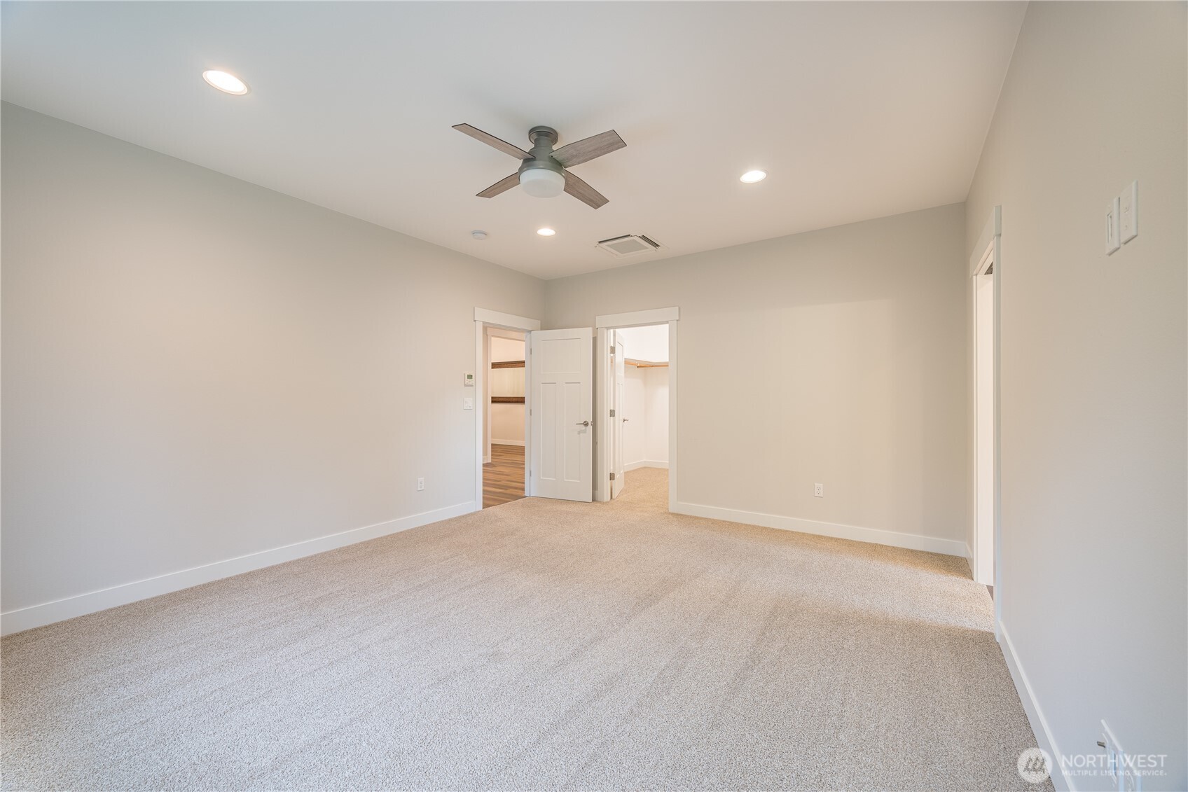 127 Sunrise View Avenue Sequim, WA 98382 - Photo 18 of 31 an empty room with closet and a ceiling fan