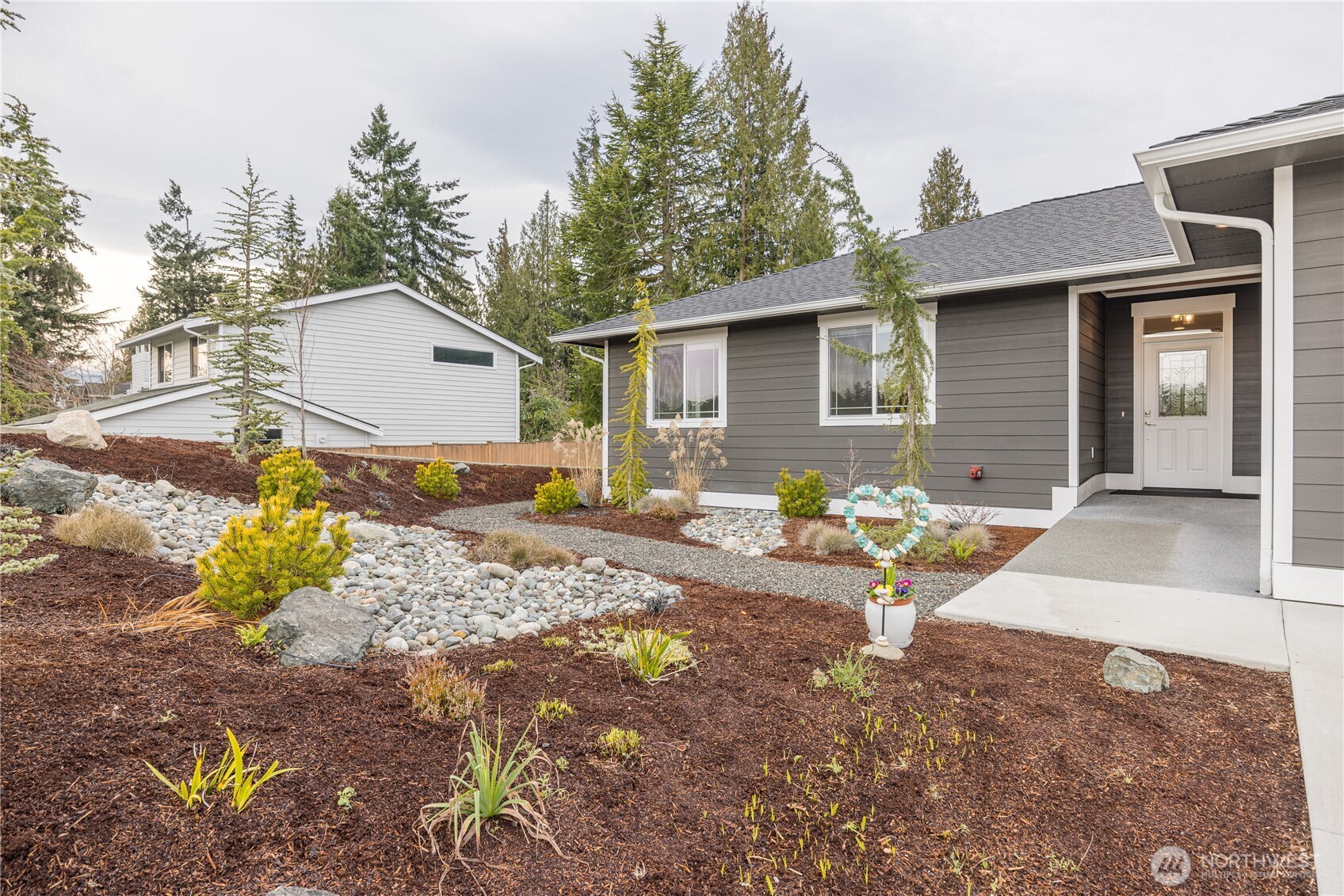 127 Sunrise View Avenue Sequim, WA 98382 - Photo 2 of 31 a front view of a house with a yard and seating space