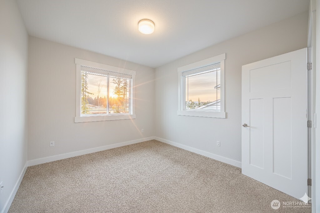 127 Sunrise View Avenue Sequim, WA 98382 - Photo 25 of 31 an empty room with windows
