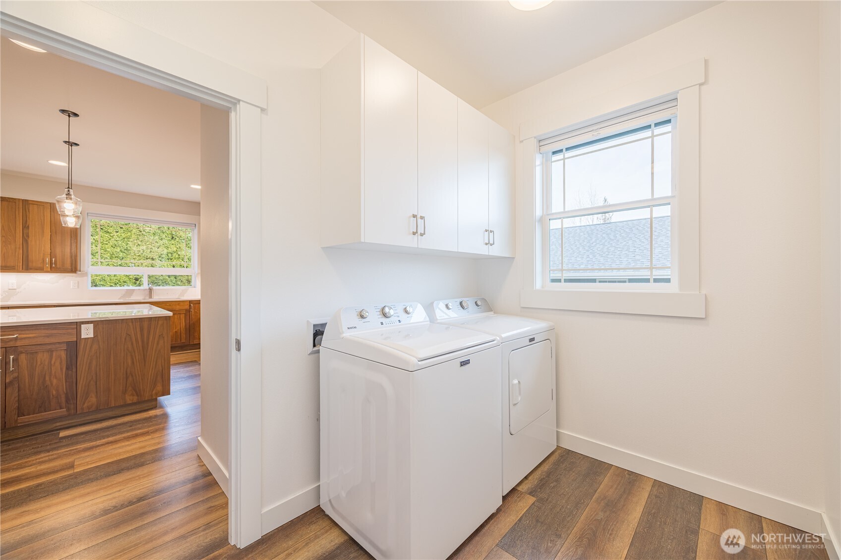 127 Sunrise View Avenue Sequim, WA 98382 - Photo 27 of 31 a view of a kitchen with wooden floor and electronic appliances