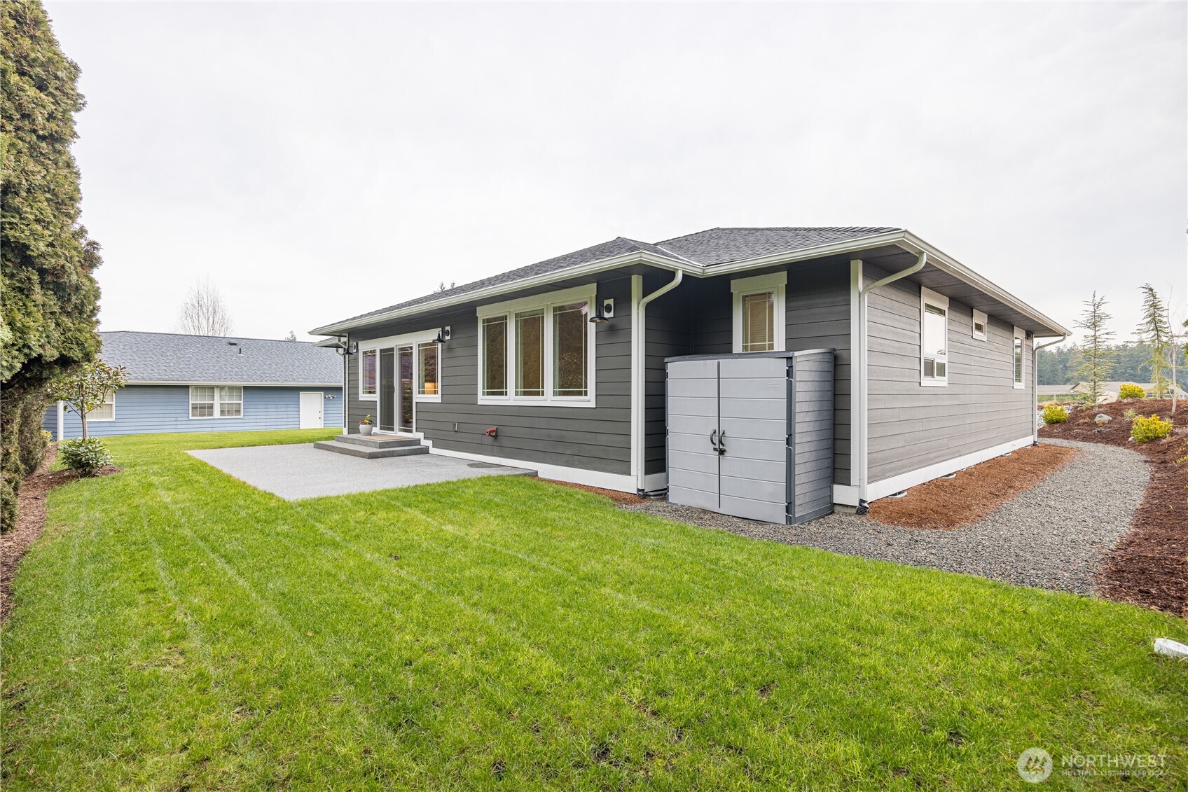 127 Sunrise View Avenue Sequim, WA 98382 - Photo 30 of 31 a front view of a house with yard and garage