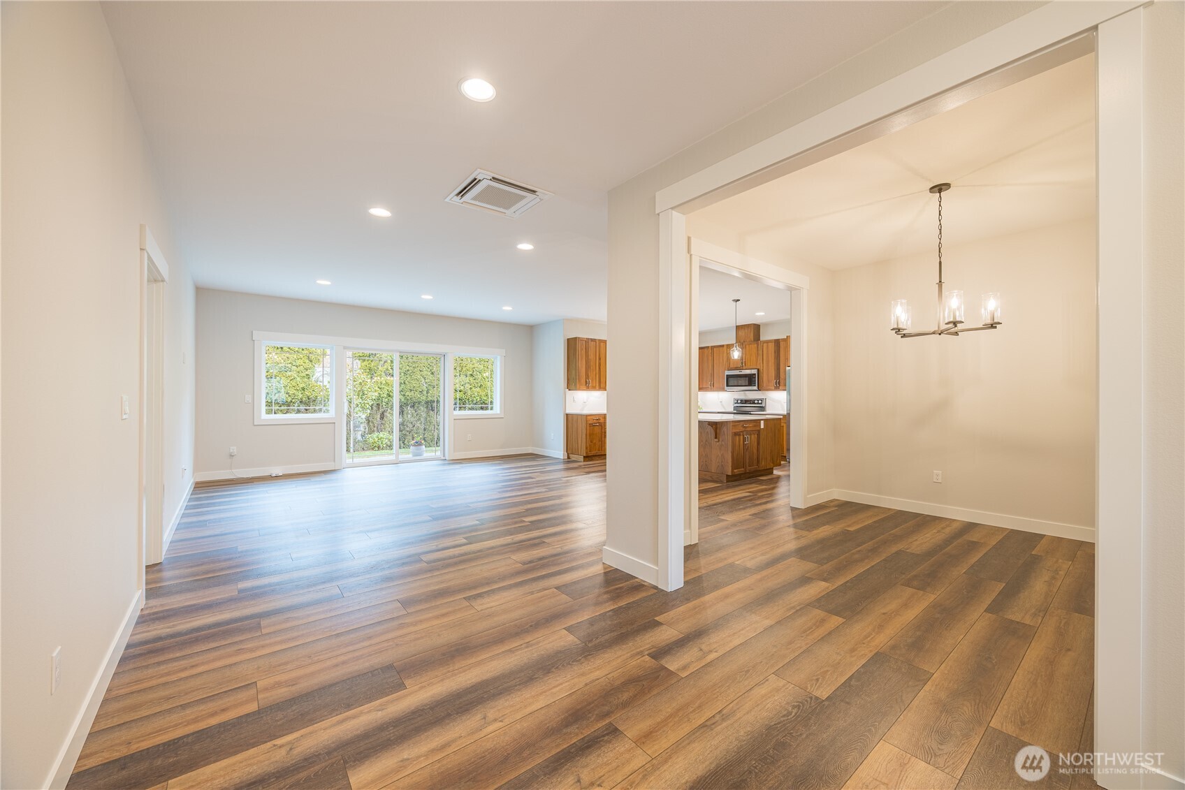 127 Sunrise View Avenue Sequim, WA 98382 - Photo 5 of 31 an empty room with wooden floor and windows