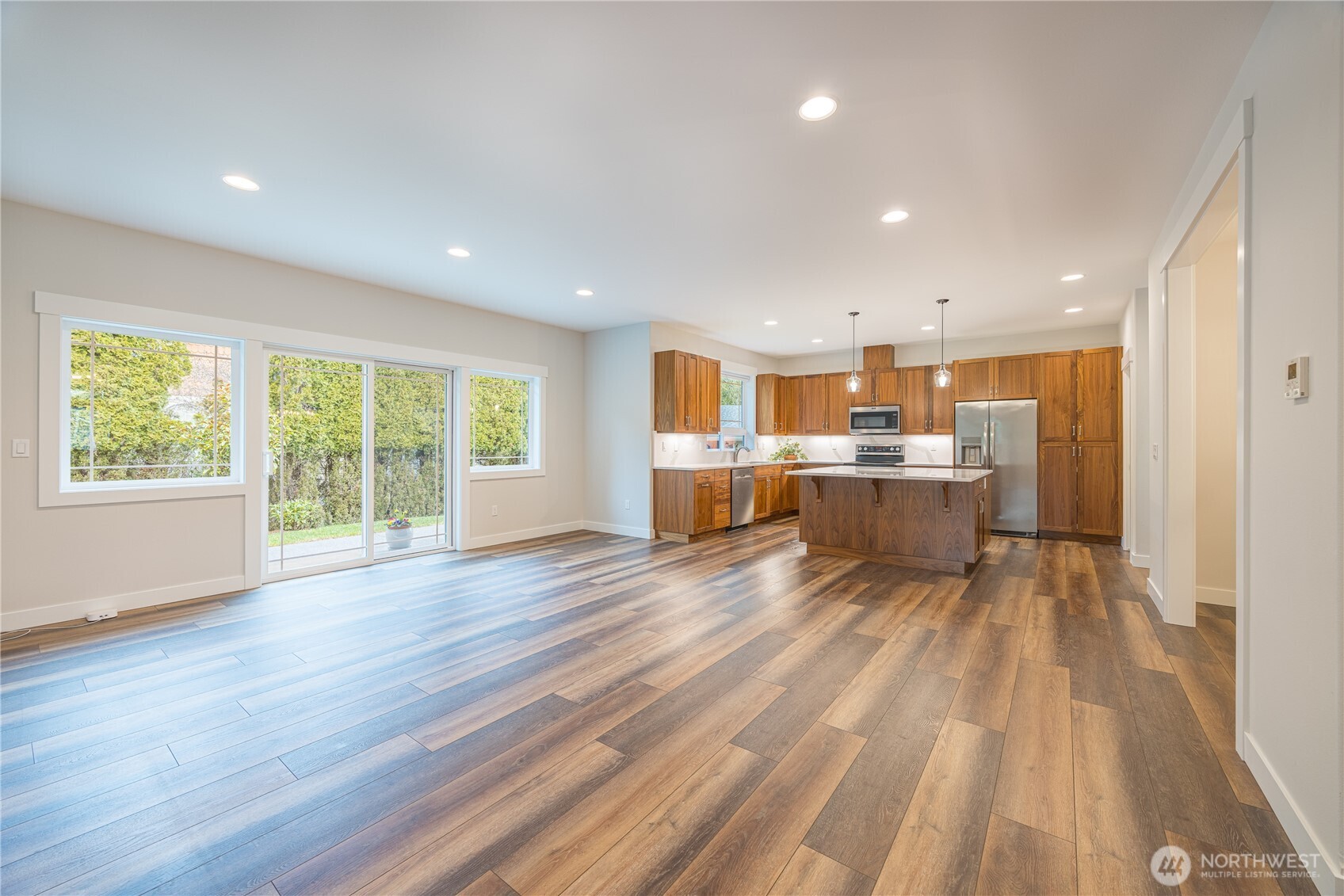 127 Sunrise View Avenue Sequim, WA 98382 - Photo 7 of 31 a view of a kitchen with wooden floor and windows