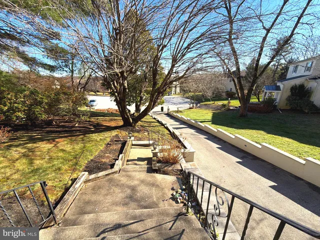 a view of swimming pool with an outdoor seating