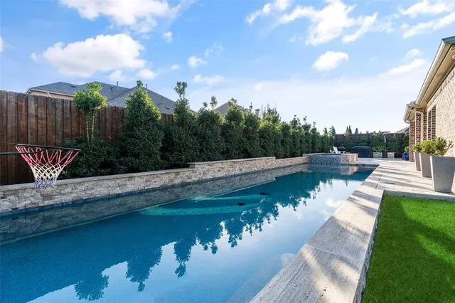 a view of a lake with a yard from a lake view