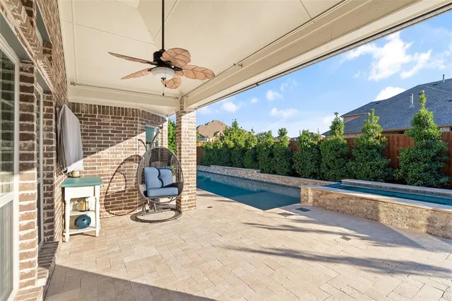 a view of a patio with a table and chairs