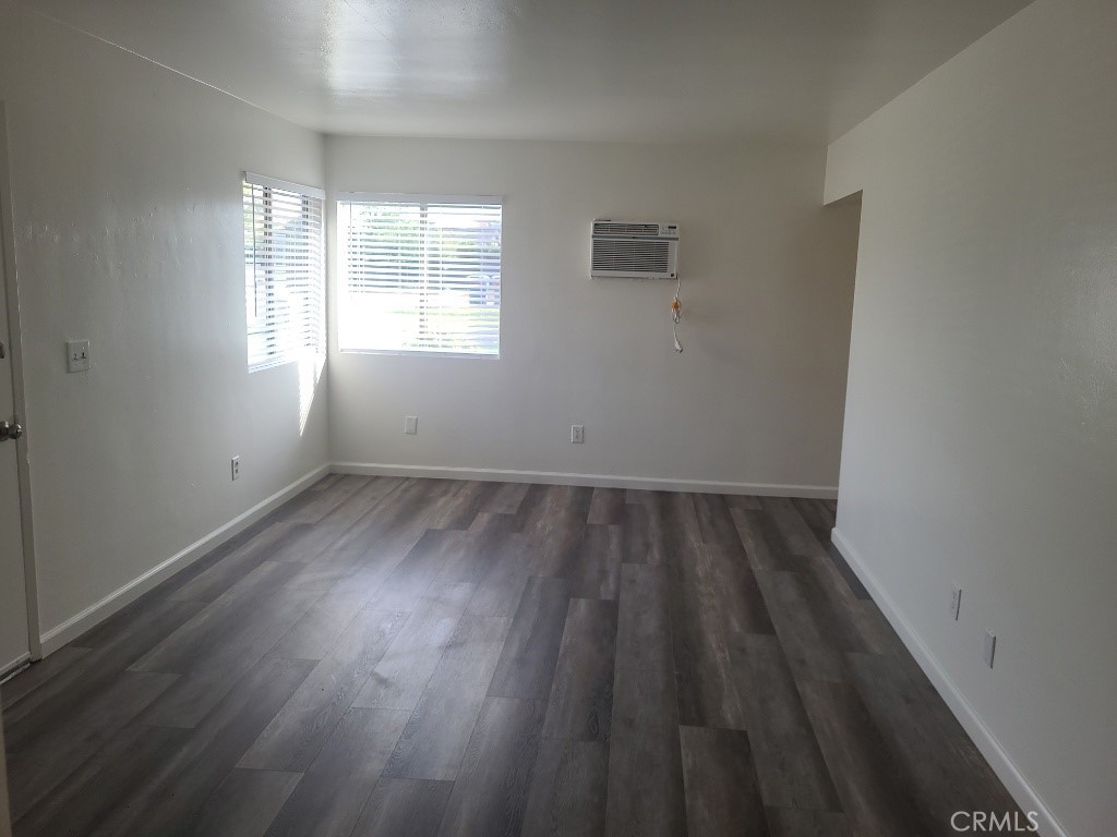 6240 Jones Riverside, CA 92505 - Photo 2 of 11 an empty room with wooden floor and windows