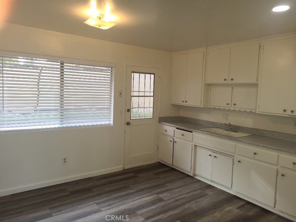6240 Jones Riverside, CA 92505 - Photo 4 of 11 a kitchen with granite countertop white cabinets and a window