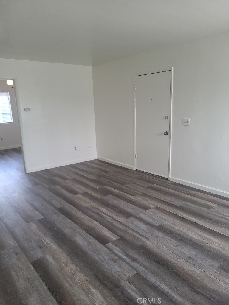 6240 Jones Riverside, CA 92505 - Photo 6 of 11 an empty room with wooden floor and windows