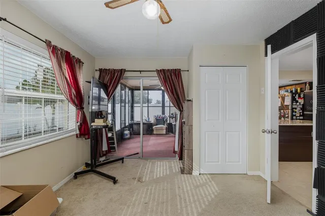 a living room with furniture a window and a chandelier