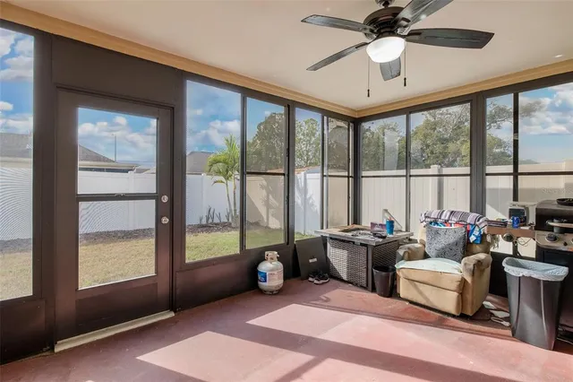 a spacious bedroom with a bed and a large window