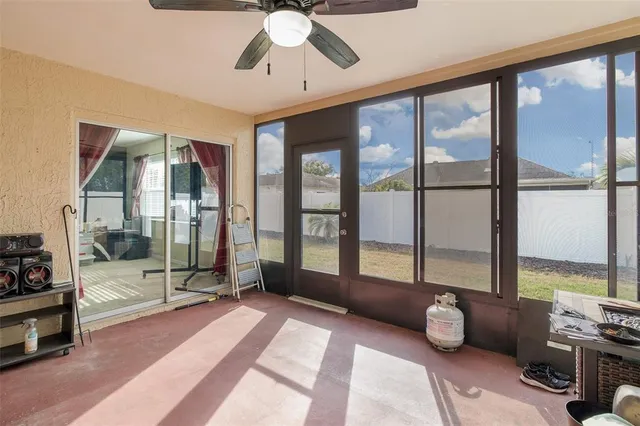 a living room with lots of furniture and a equipment