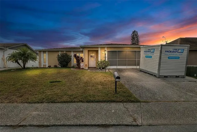 a view of a house with a yard
