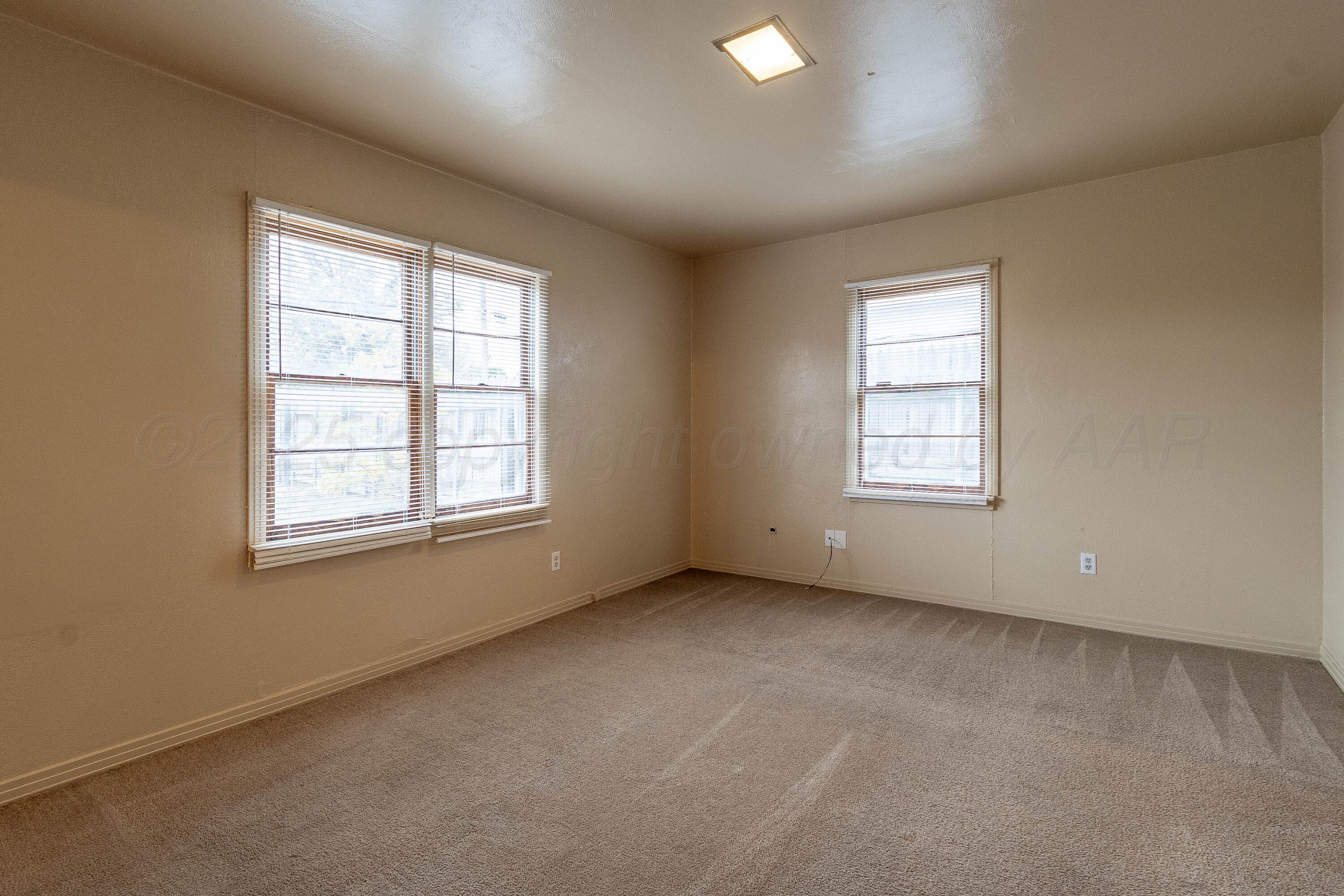 2414 Orange Street Amarillo, TX 79107 - Photo 7 of 16 an empty room with windows