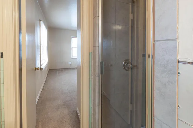 a view of a bathroom from a hallway