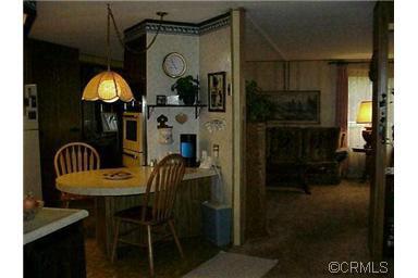 150 Clinton Road, Unit 26 Jackson, CA 95642 - Photo 5 of 5 a view of a dining room with furniture and wooden floor