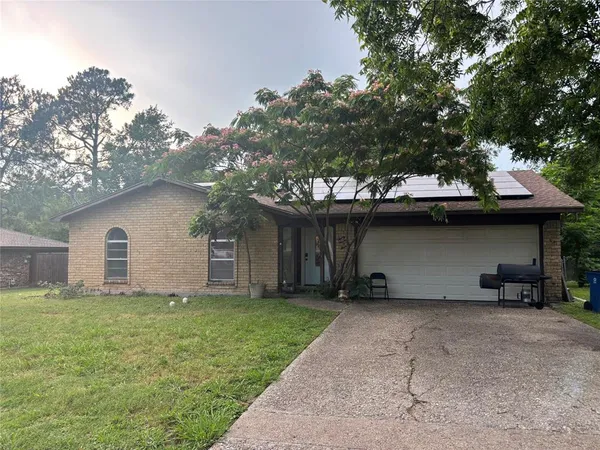 a house with a tree in front of it