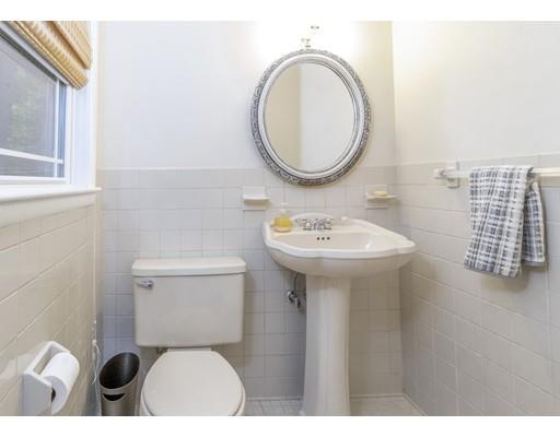 58 Oakvale Road Framingham, MA 01701 - Photo 12 of 30 a bathroom with a sink a toilet and a mirror