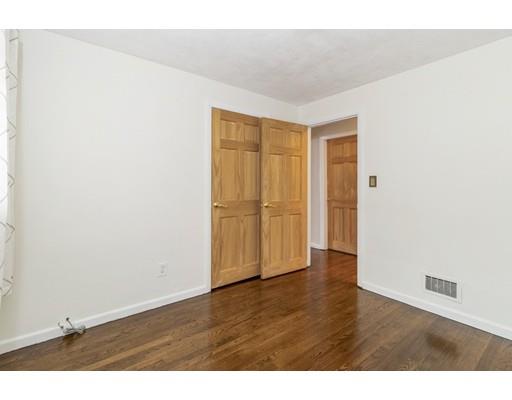 58 Oakvale Road Framingham, MA 01701 - Photo 15 of 30 an empty room with wooden floor and windows