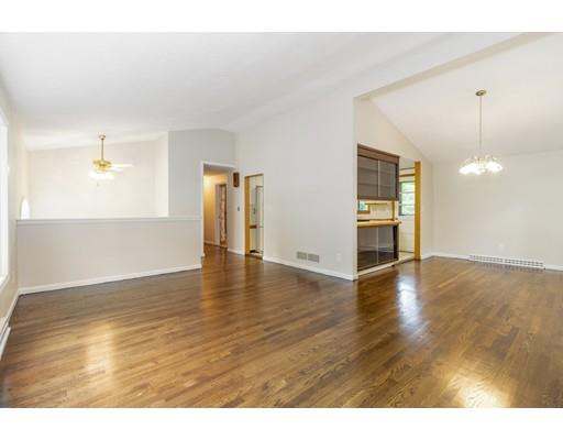58 Oakvale Road Framingham, MA 01701 - Photo 2 of 30 a view of an empty room with wooden floor and a window