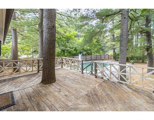 58 Oakvale Road Framingham, MA 01701 - Photo 24 of 30 a view of a patio with table and chairs with wooden floor and fence