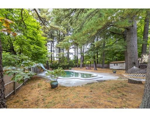 58 Oakvale Road Framingham, MA 01701 - Photo 27 of 30 a backyard of a house with a fountain and outdoor seating