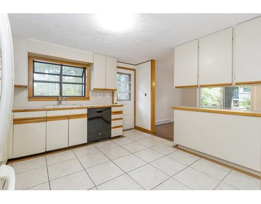 58 Oakvale Road Framingham, MA 01701 - Photo 8 of 30 a kitchen with a stove a sink and a refrigerator