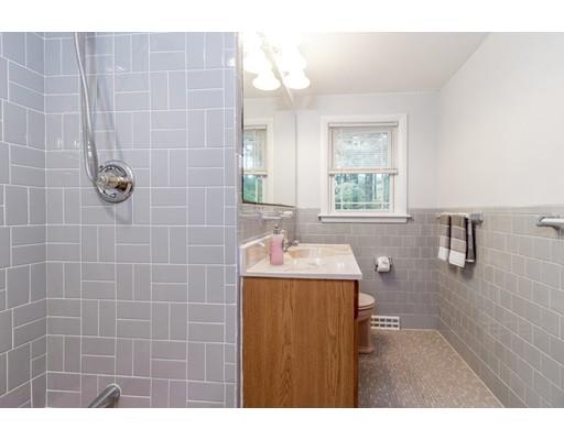 58 Oakvale Road Framingham, MA 01701 - Photo 10 of 30 a bathroom with a sink a toilet and mirror