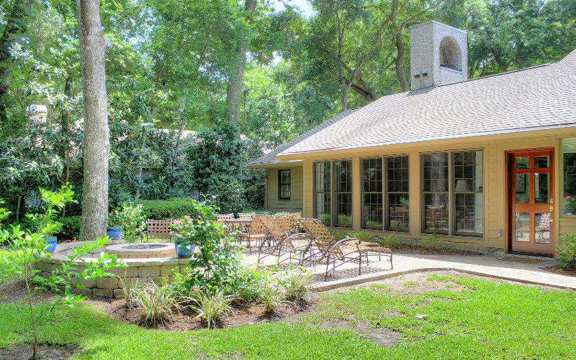 10 Willow Pond Road Fernandina Beach, FL 32034 - Photo 13 of 24 a front view of a house with a yard table and chairs