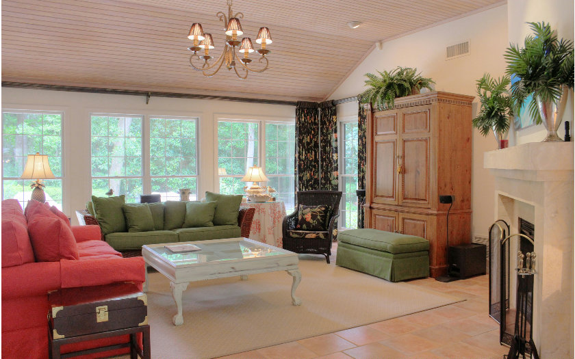 10 Willow Pond Road Fernandina Beach, FL 32034 - Photo 3 of 24 a living room with furniture a fireplace and a chandelier