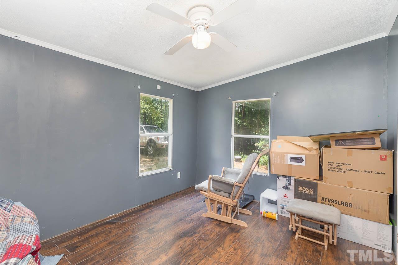 1339 Wiley Road Spring Hope, NC 27882 - Photo 12 of 22 a bed room with a bed and a window