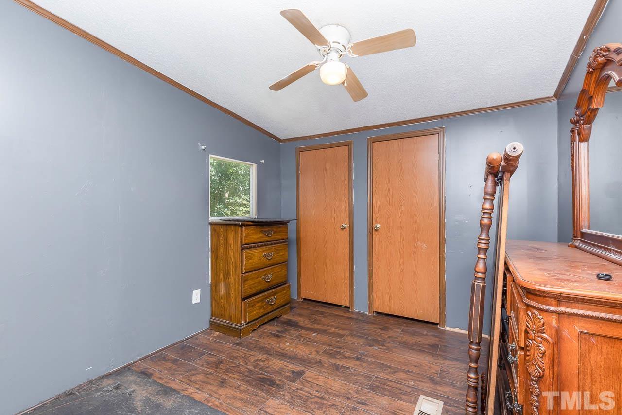 1339 Wiley Road Spring Hope, NC 27882 - Photo 14 of 22 an empty room with closet and wooden floor