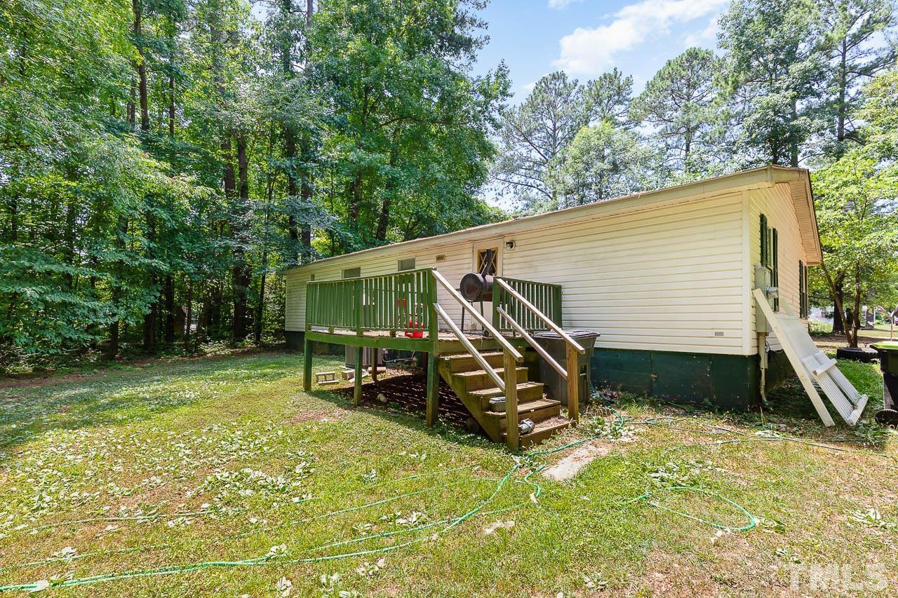 1339 Wiley Road Spring Hope, NC 27882 - Photo 19 of 22 a view of backyard with a table and chairs