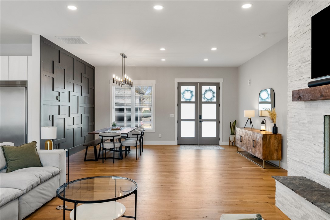 101 Casselberry Court Anderson, SC 29621 - Photo 11 of 48 This bright and open-concept space features warm hardwood flooring, a statement fireplace, and abundant natural light.