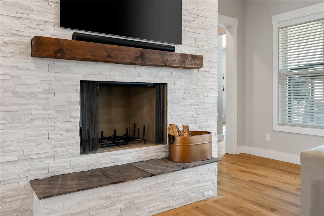 101 Casselberry Court Anderson, SC 29621 - Photo 12 of 48 This living area features a warm fireplace and hardwood floors.
