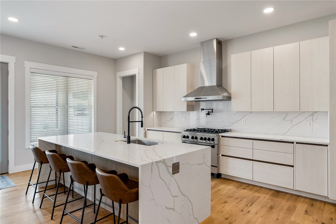101 Casselberry Court Anderson, SC 29621 - Photo 13 of 48 This modern kitchen features a spacious island and sleek appliances, perfect for culinary adventures.