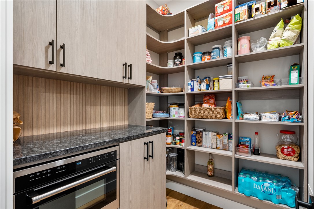 101 Casselberry Court Anderson, SC 29621 - Photo 19 of 48 This spacious pantry features custom built-in shelving, offering ample storage for all your culinary needs.